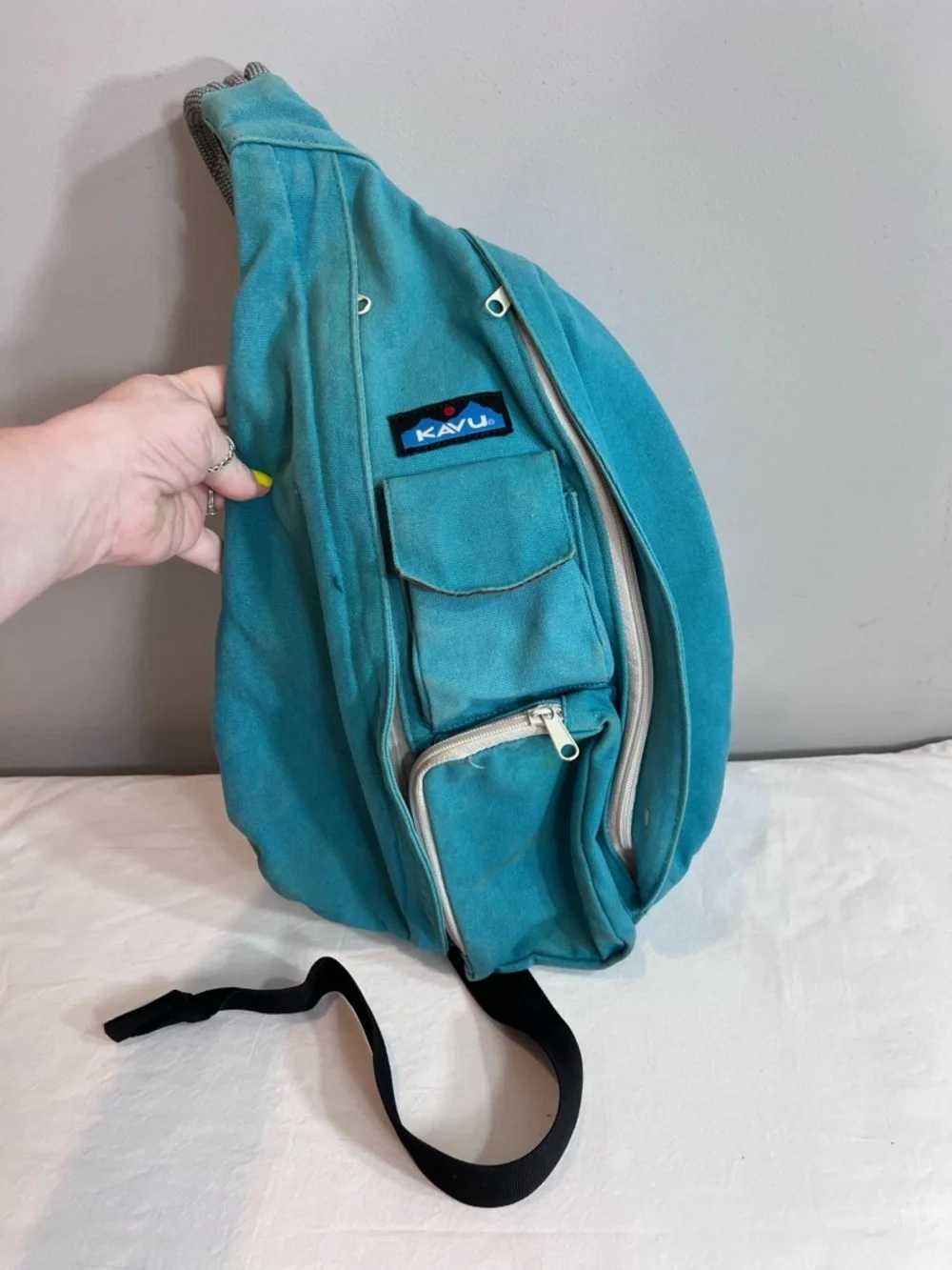 Kavu teal rope sling bag backpack